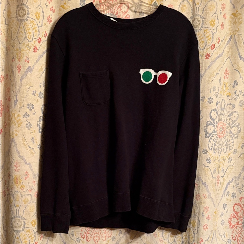 Society Black Sweatshirt with Red and Green Glasses Patch